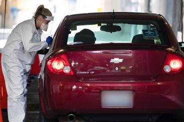 Person talking to someone in a car